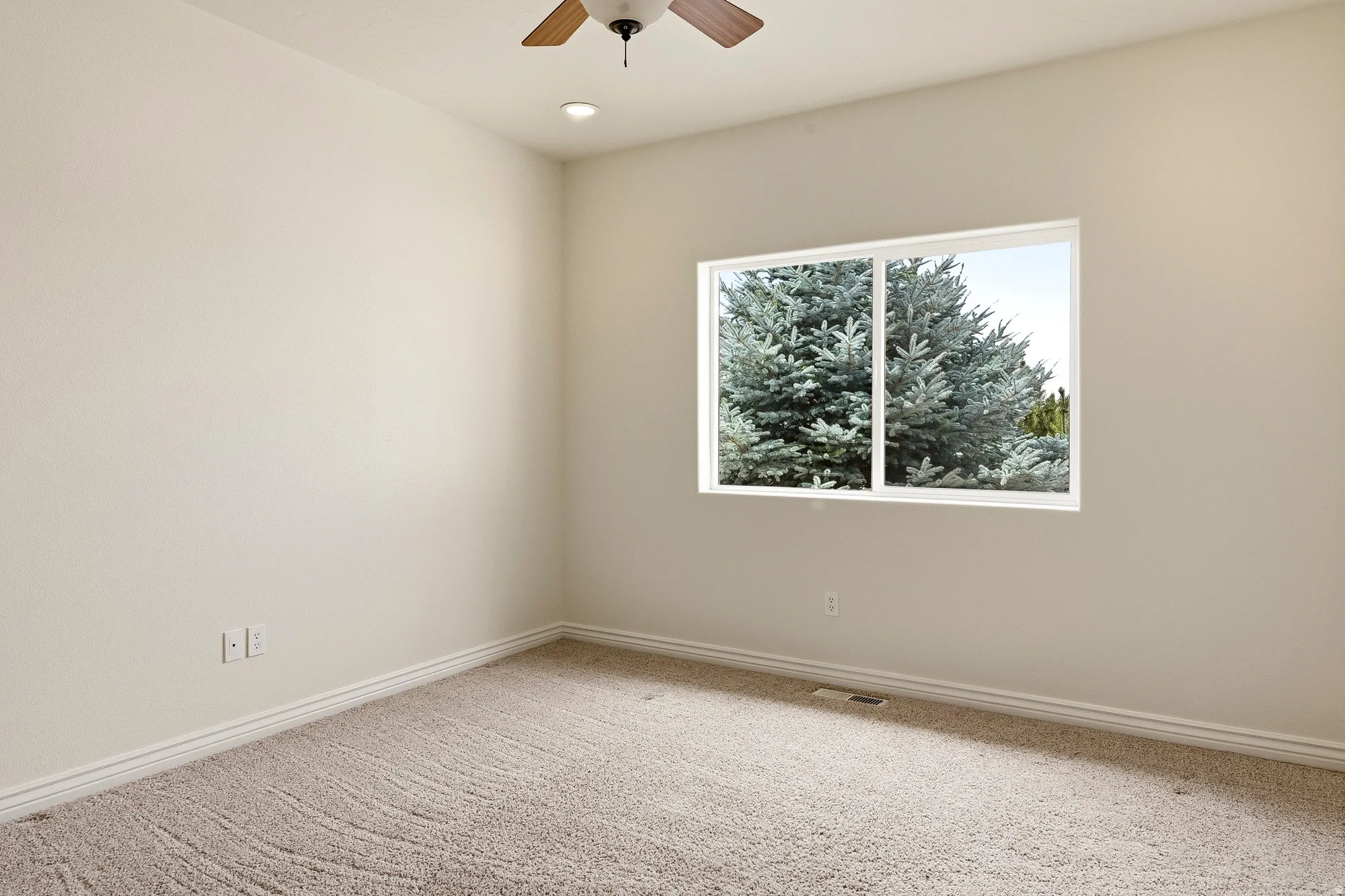 Recessed lighting, wood-finish ceiling fan, neutral wall tones, white trim, and carpet flooring