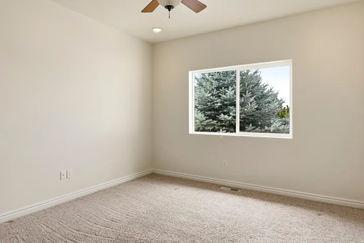 Recessed lighting, wood-finish ceiling fan, neutral wall tones, white trim, and carpet flooring