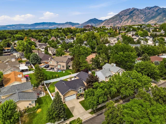 Mountainous backdrop framing a residential neighborhood with mature trees