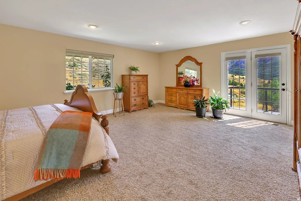 Spacious master suite with views, opens to deck