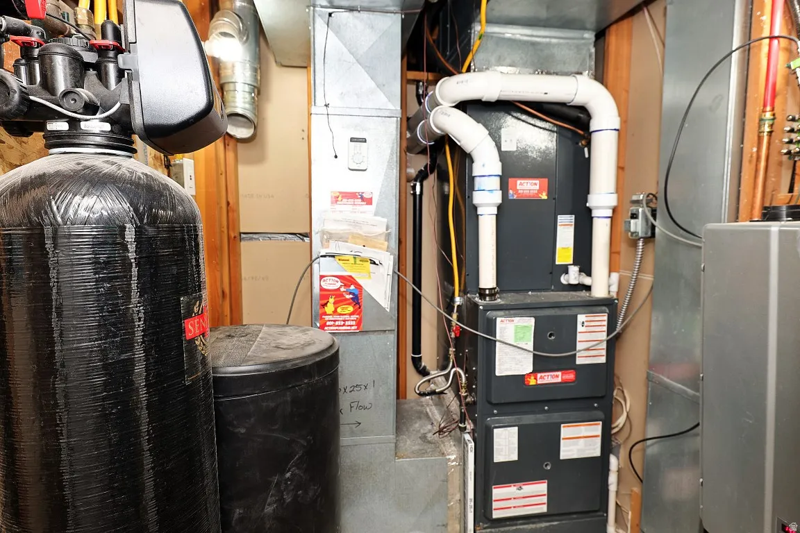 Mechanical room. Furnace, air conditioner, water heater and whole home humidifier, 5 years new.