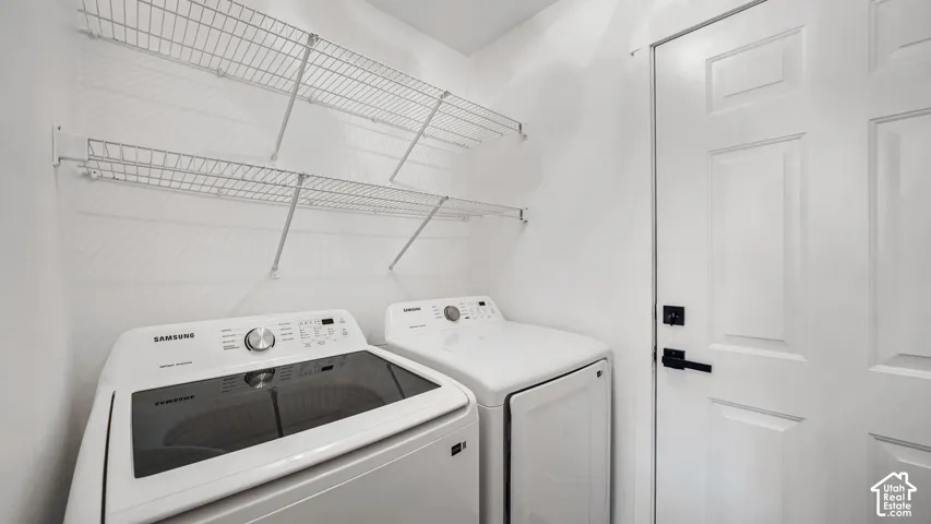 Laundry area featuring white wire shelving