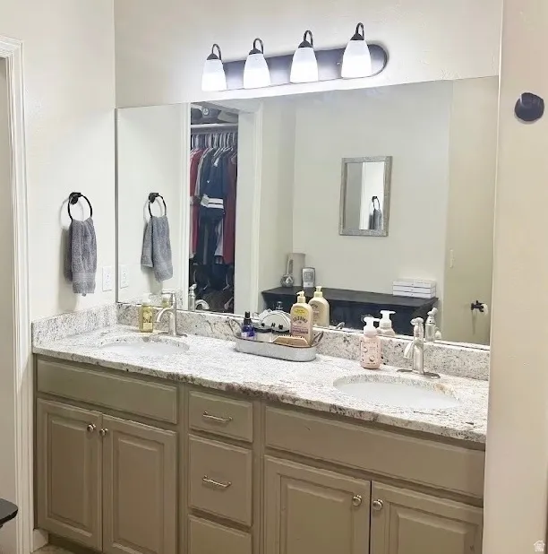 Dual undermount sinks set into a light-colored countertop