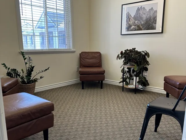 Neutral-toned walls complement patterned carpet flooring