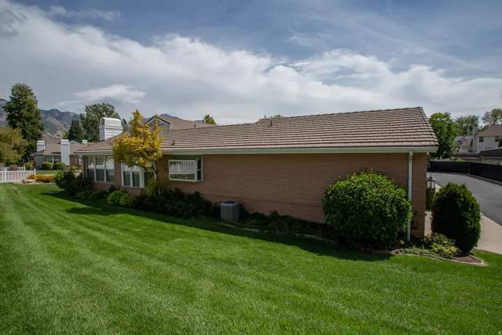 Expansive lawn area with mature landscaping