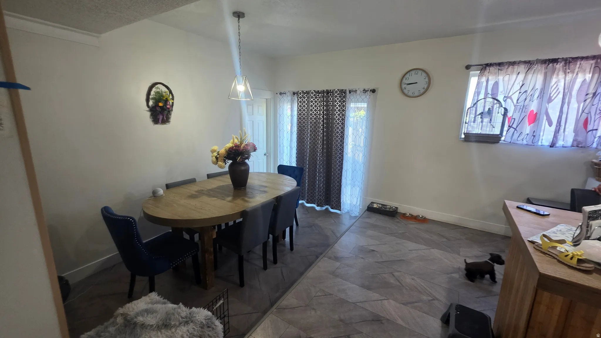 Recessed lighting, contemporary pendant light fixture, light wood-finish flooring, sliding glass door, and built-in countertop