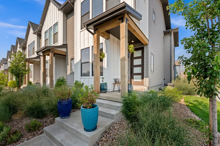 Modern multi-story exterior with vertical siding and contrasting horizontal siding