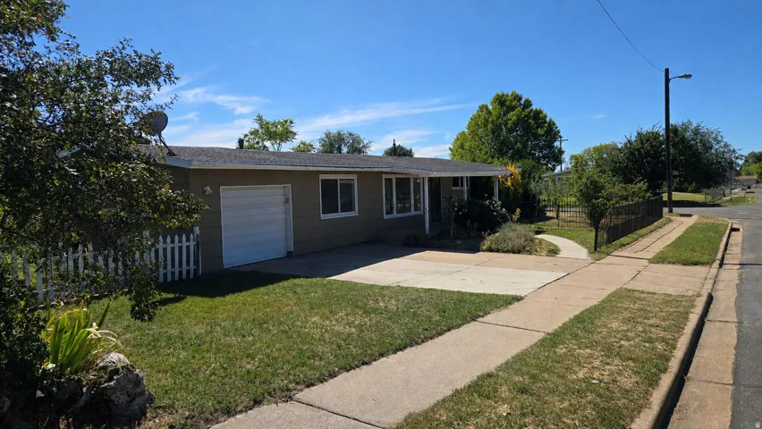 Single-story residence with a paved driveway and an attached garage