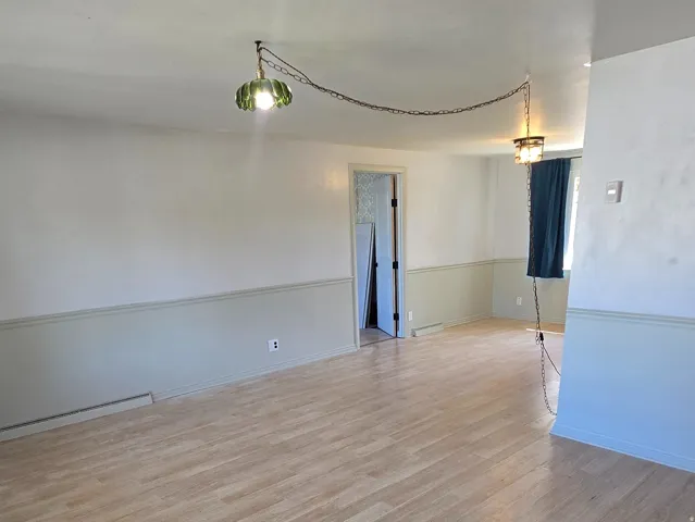 Wood-finish flooring with a tile inlay