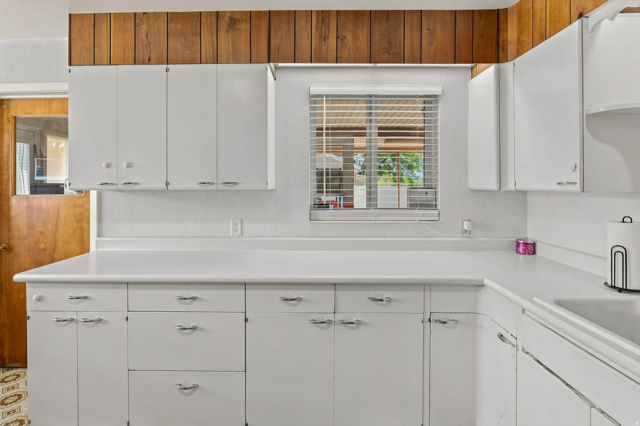 White cabinetry with chrome hardware