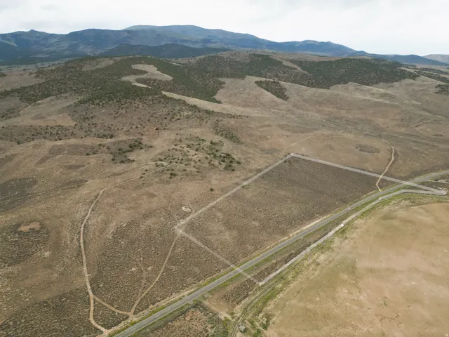Expansive land parcel with surrounding mountains