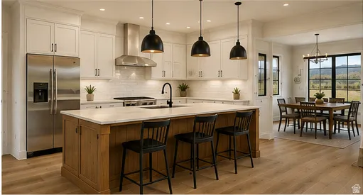Gourmet kitchen with white cabinetry, stainless steel appliances, a center island with seating, and wood-finish flooring