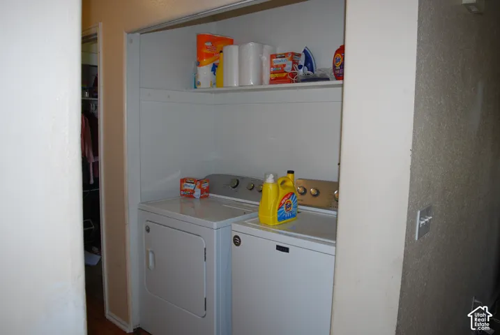 Laundry alcove with built-in shelving