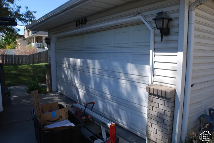 Attached single-car garage with horizontal panel door