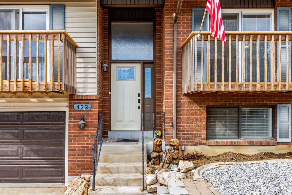 Brick exterior with a prominent entry door and sidelight