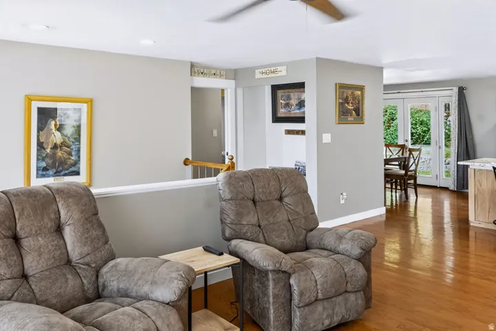 Hardwood flooring, recessed lighting, and a ceiling fan