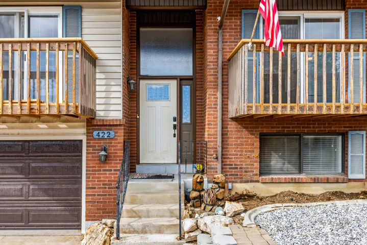 Brick exterior with a prominent entry door and sidelight