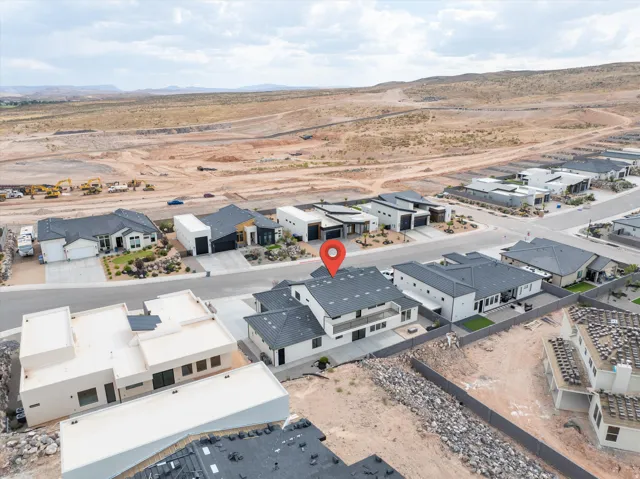 Aerial perspective showcasing a contemporary residential property with a multi-level design