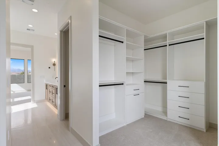 Custom-built closet system with shelving and drawer storage