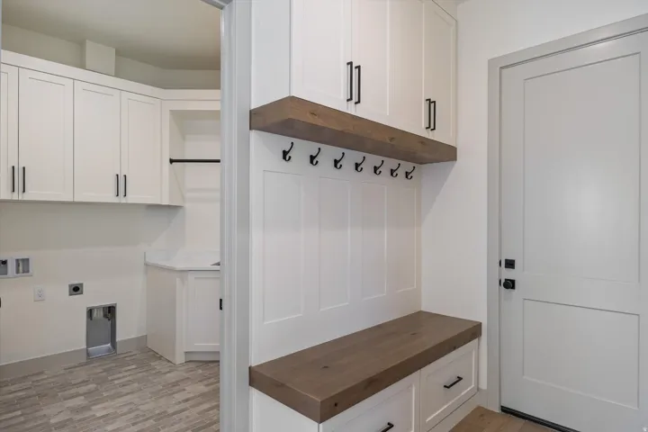 Built-in wood-finish bench with integrated storage drawers