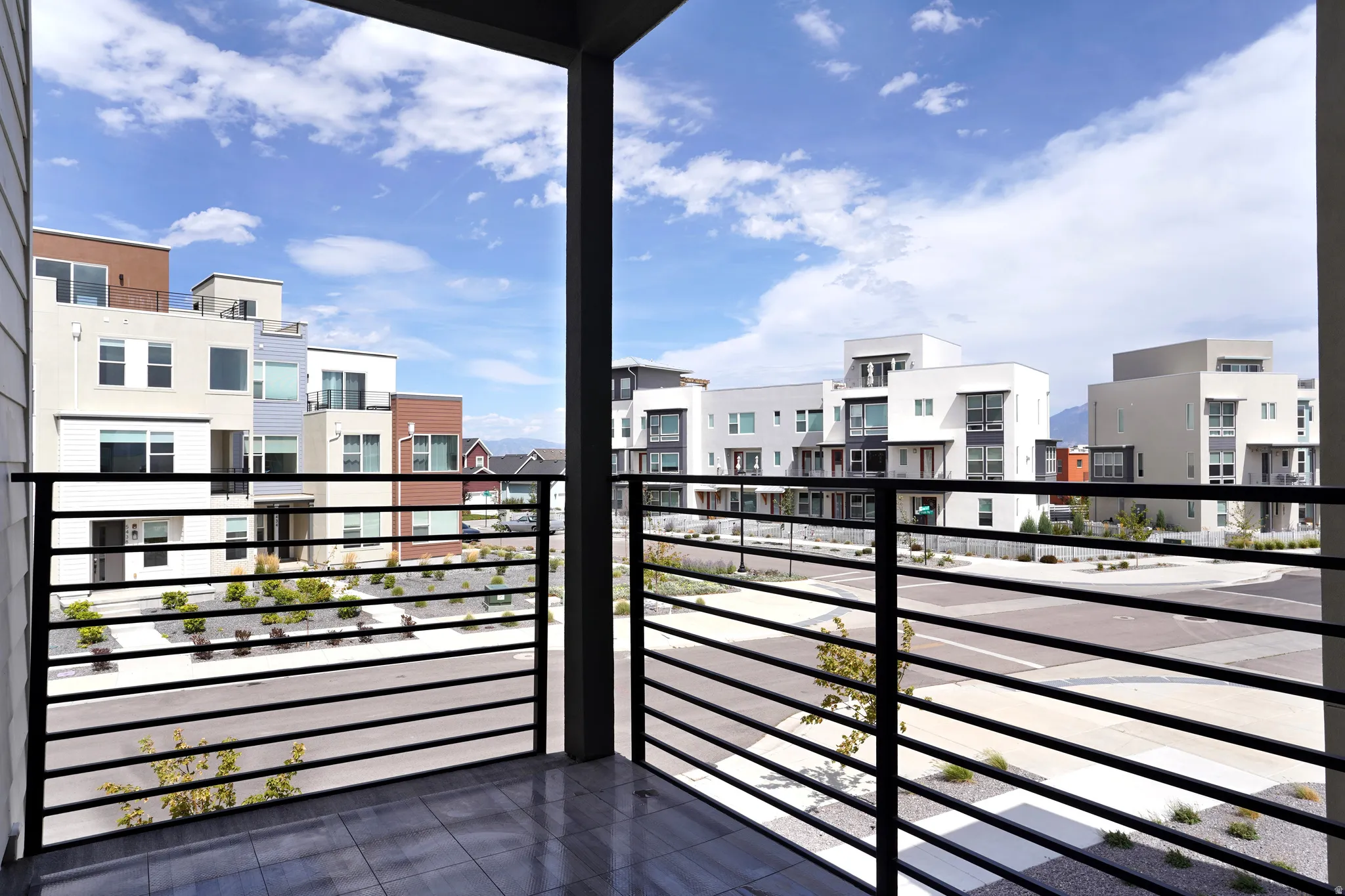 Balcony with black metal railing