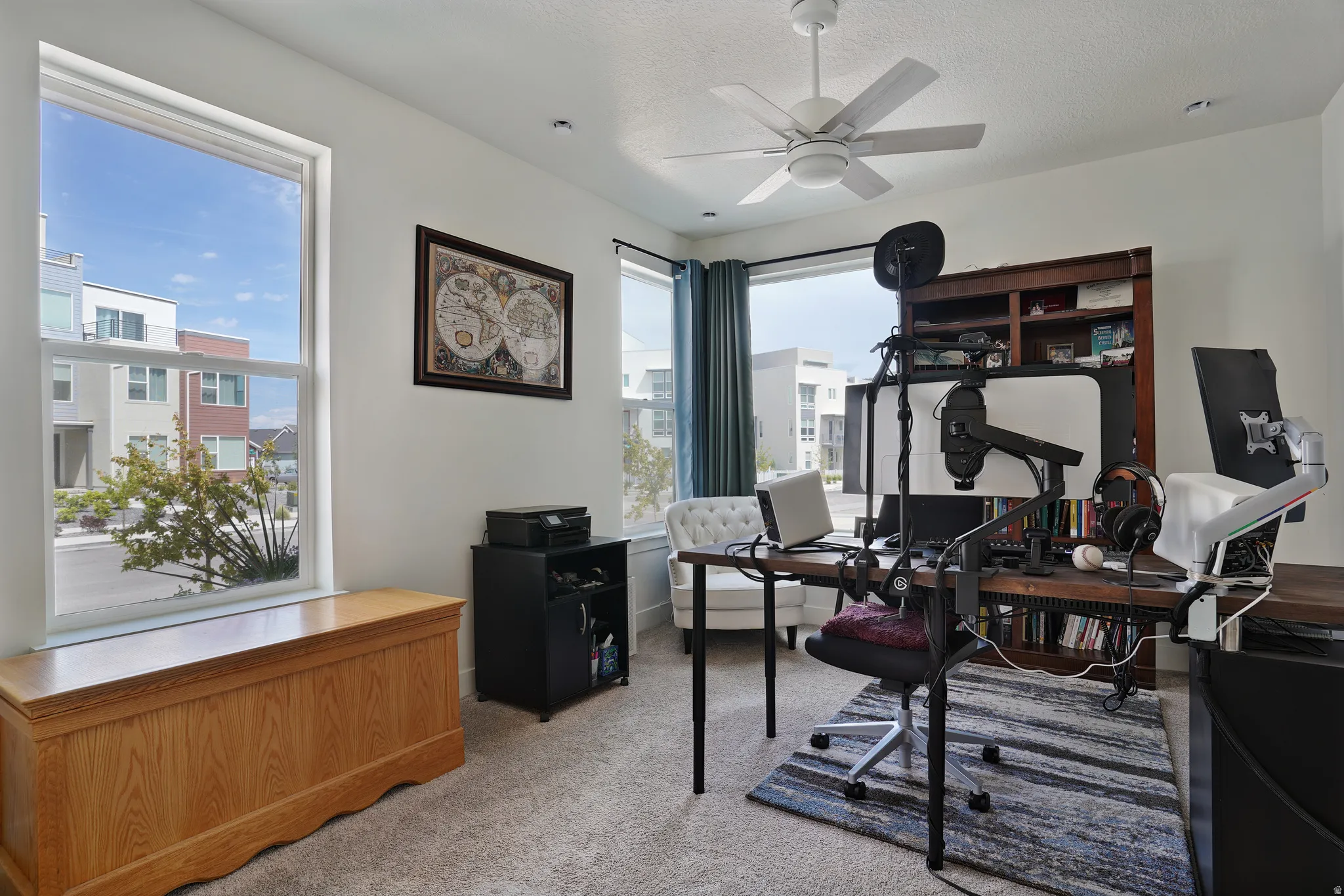 Recessed lighting, ceiling fan, and carpeted flooring