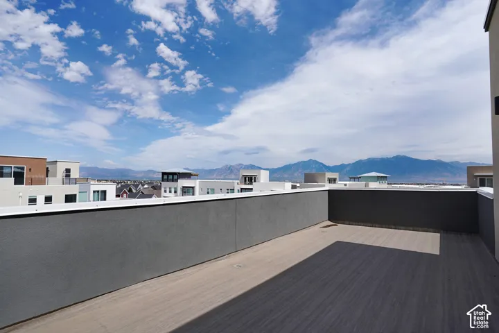 Expansive rooftop deck with composite decking and low-profile perimeter walls