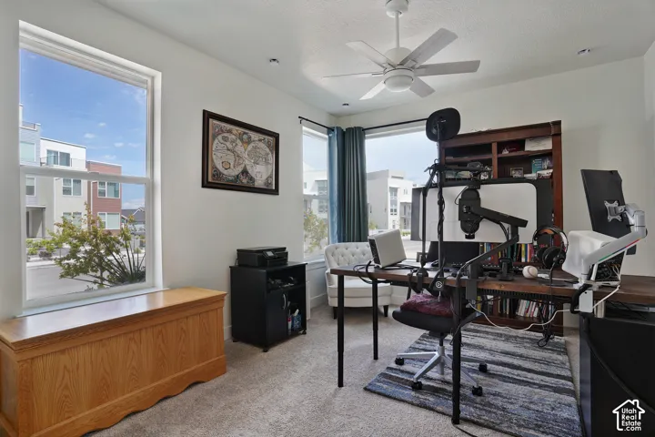 Recessed lighting, ceiling fan, and carpeted flooring