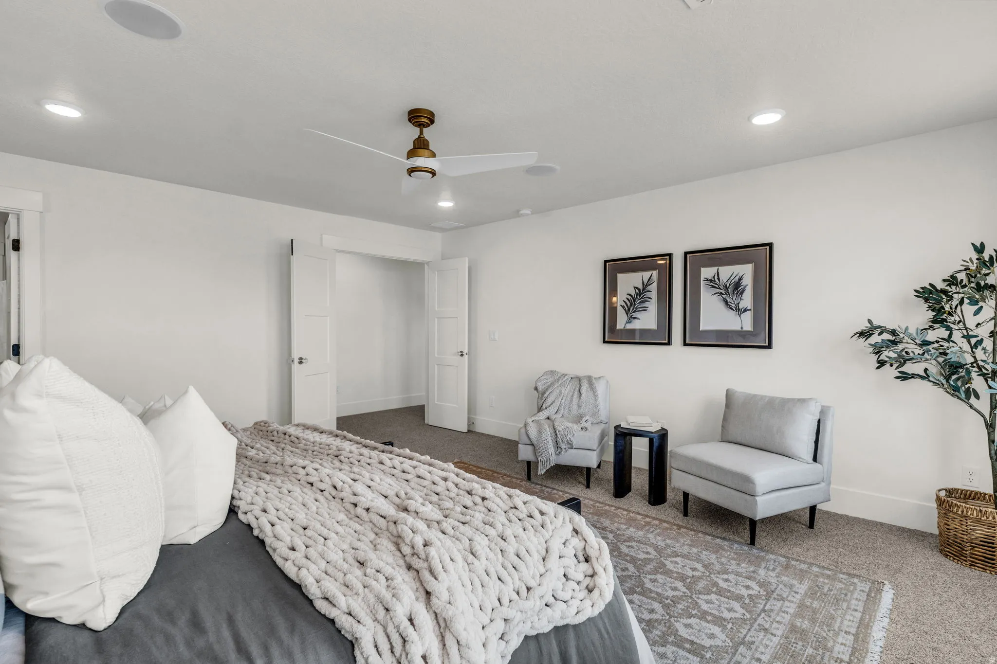 Recessed lighting, ceiling fan, white walls, and carpeted flooring