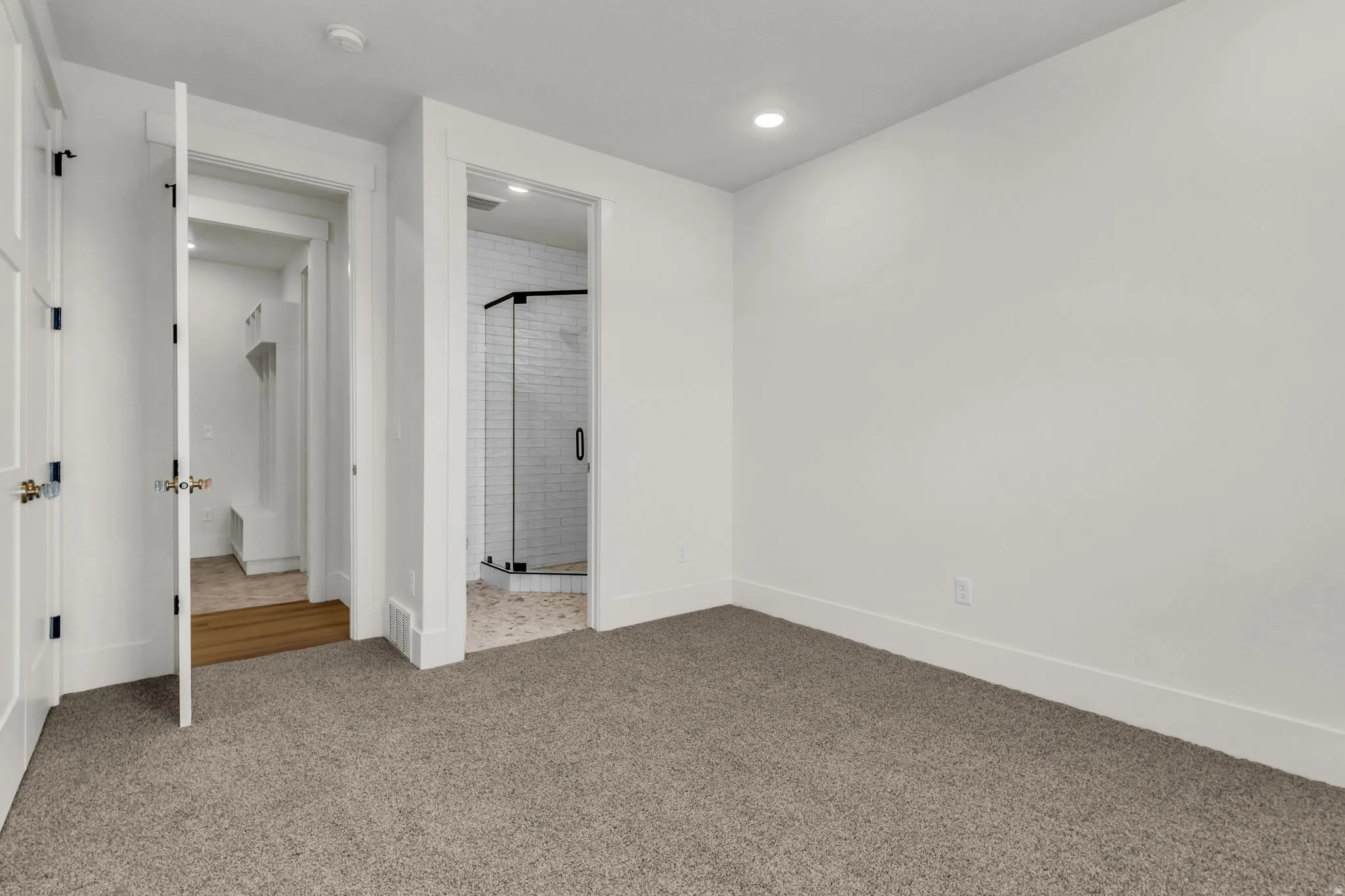 White walls, recessed lighting, and grey carpet flooring