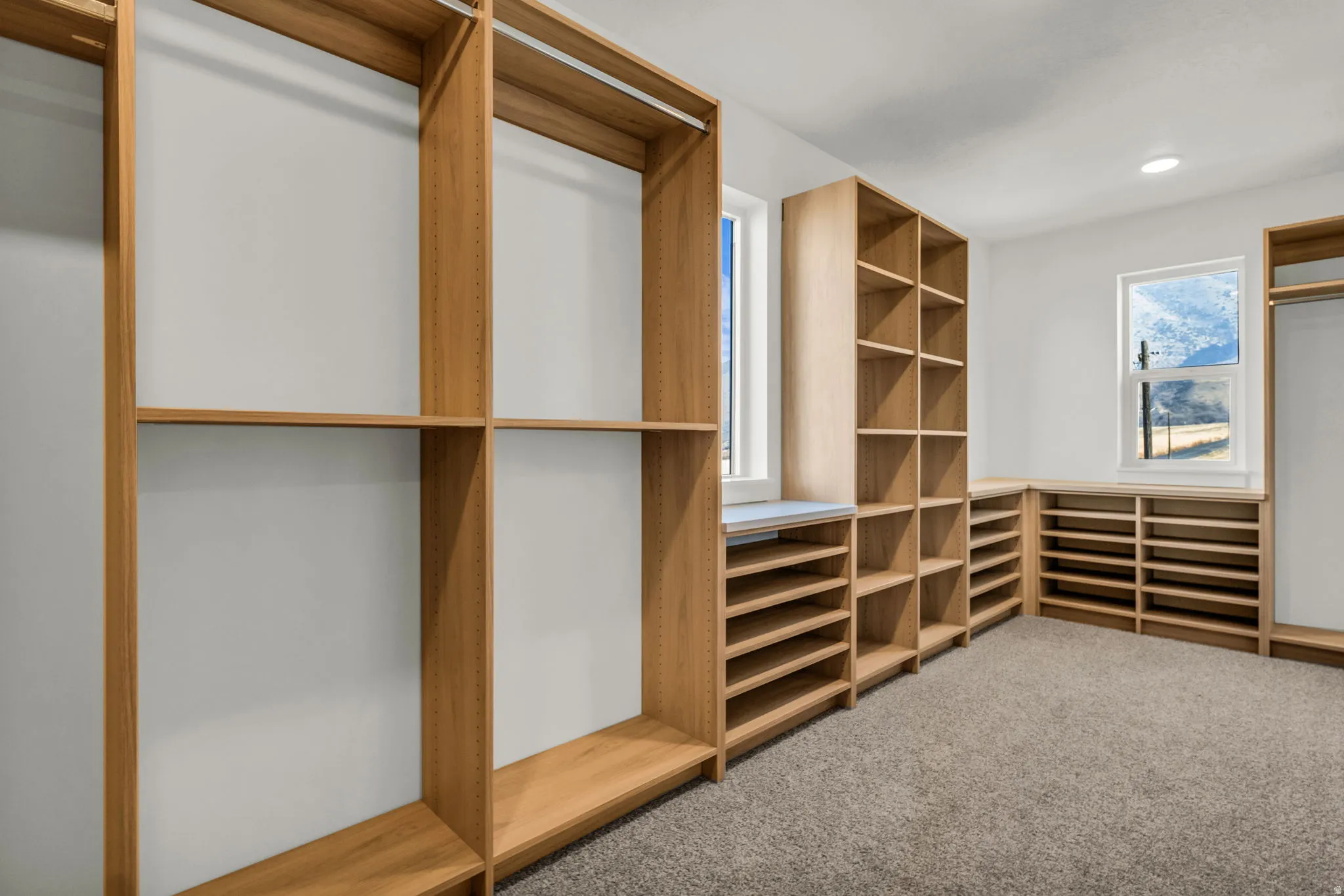 Custom wood-finish shelving and hanging rods