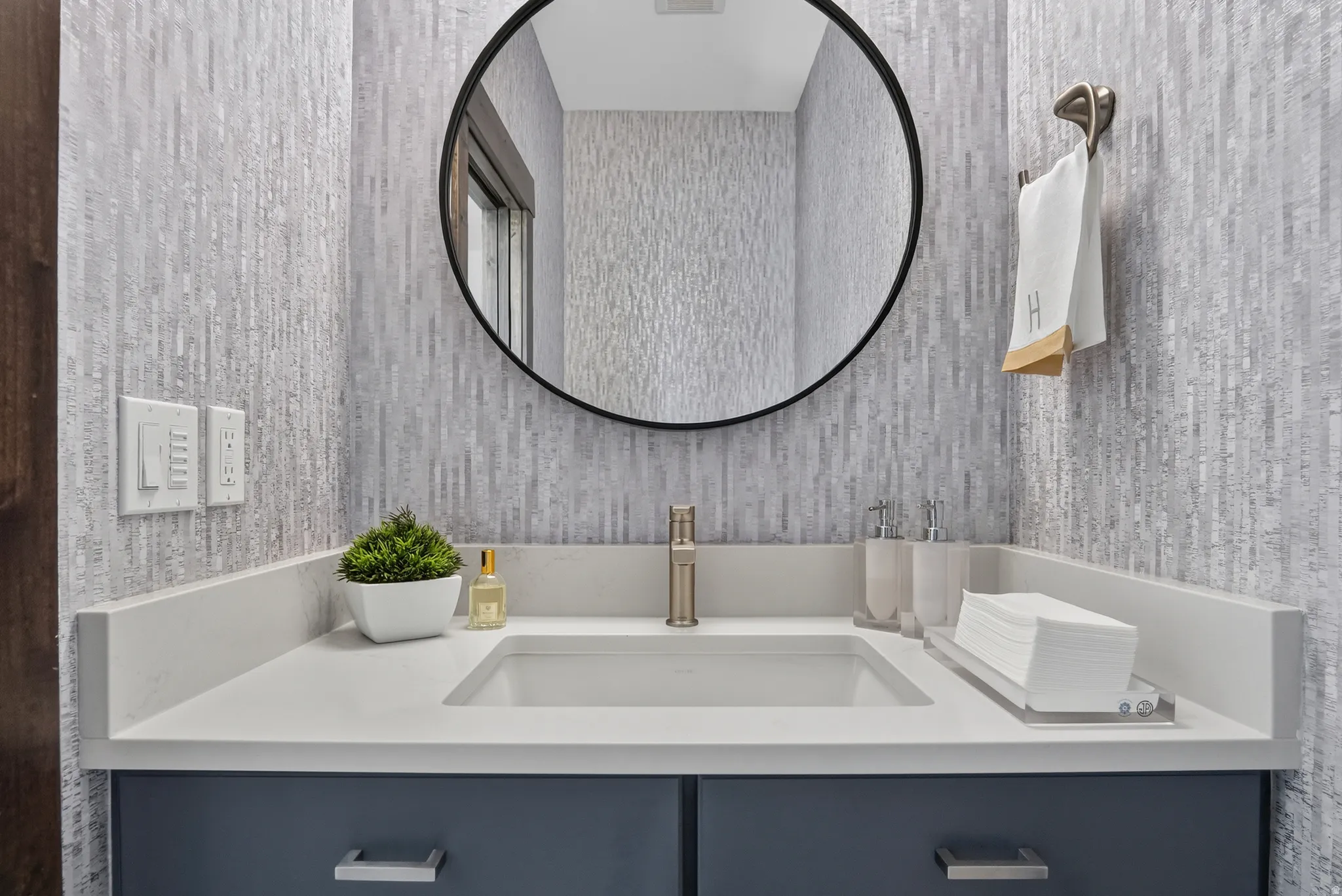 Integrated rectangular sink with a single-handle faucet, set into a white countertop