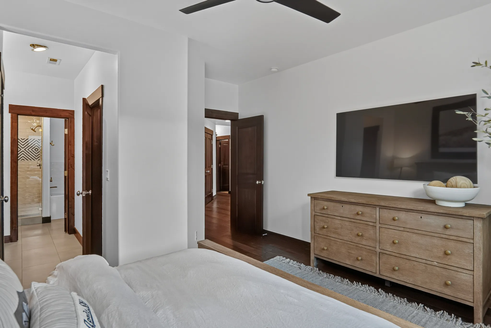 White interior walls with dark wood-finish door frames