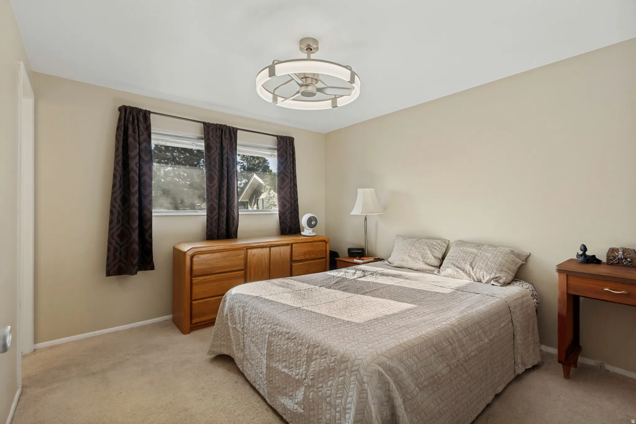 Cream-colored walls with light-toned carpeting