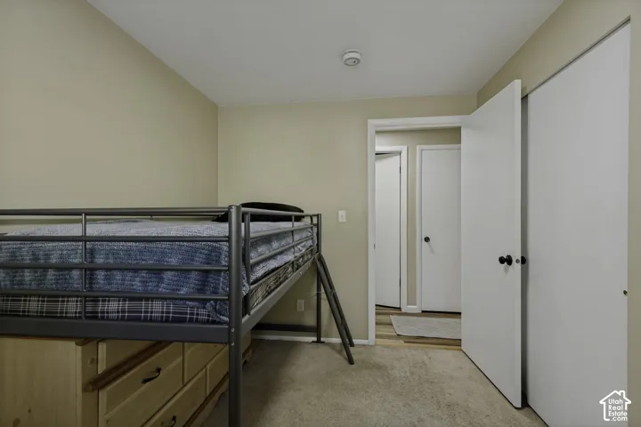 Neutral-toned walls complement the light beige carpeting