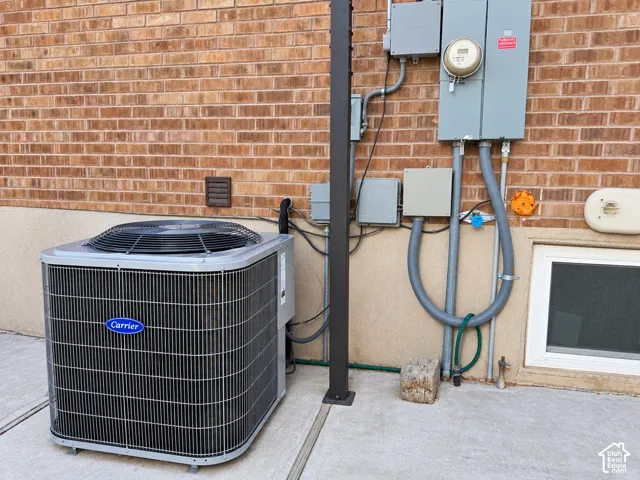 Brick exterior wall with a Carrier brand air conditioning unit