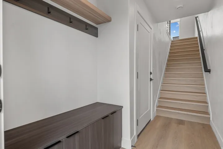 Built-in storage cabinetry with dark hardware