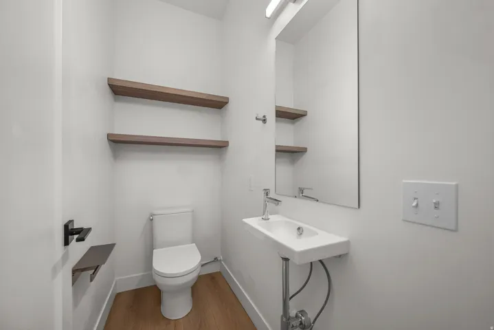 Wall-mounted vanity with rectangular basin and chrome faucet