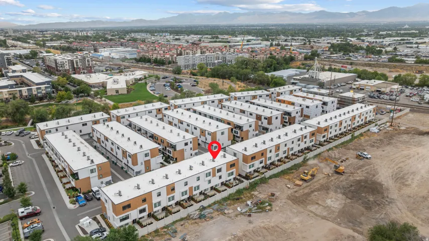 Modern townhome community featuring a contemporary architectural style and integrated parking areas