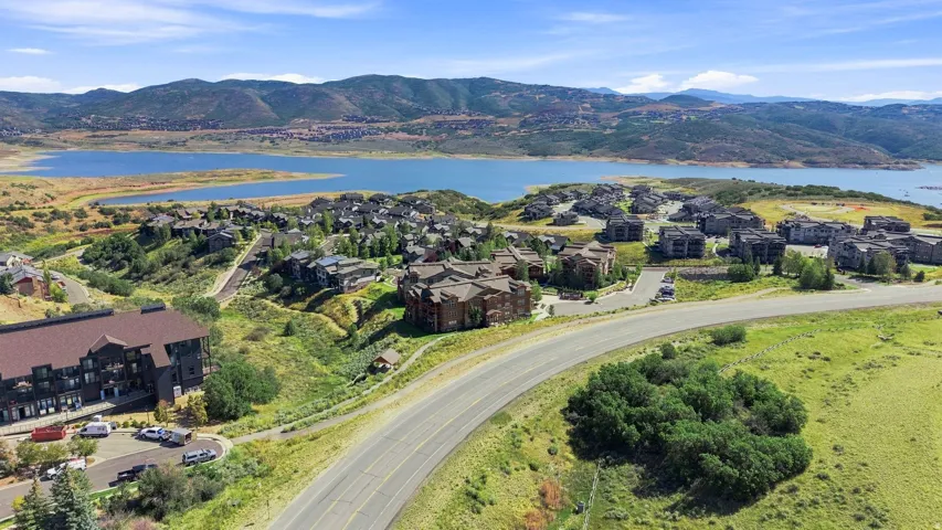 Expansive mountain and water scenery with residential structures