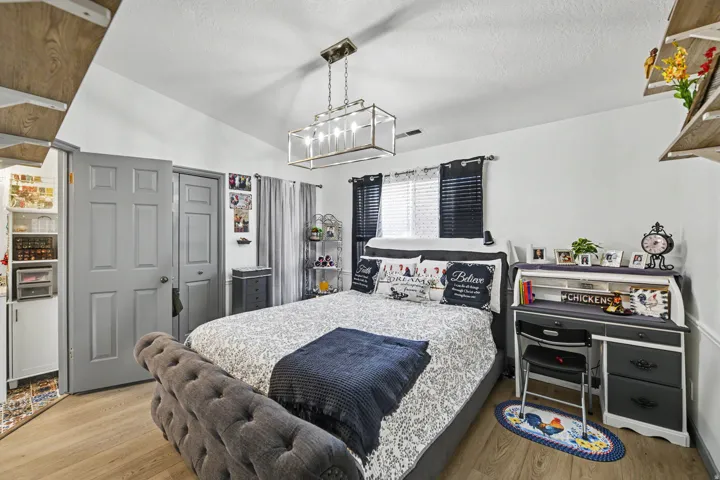 Wood-finish flooring, vaulted ceiling, and built-in shelving
