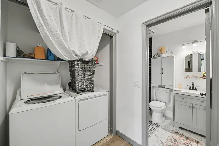 In-unit laundry area with built-in shelving