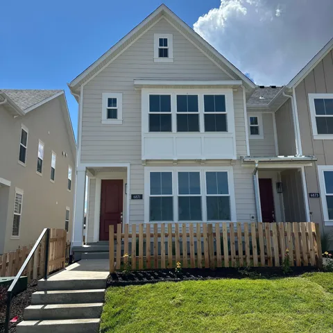 Contemporary exterior featuring horizontal siding and a prominent gable