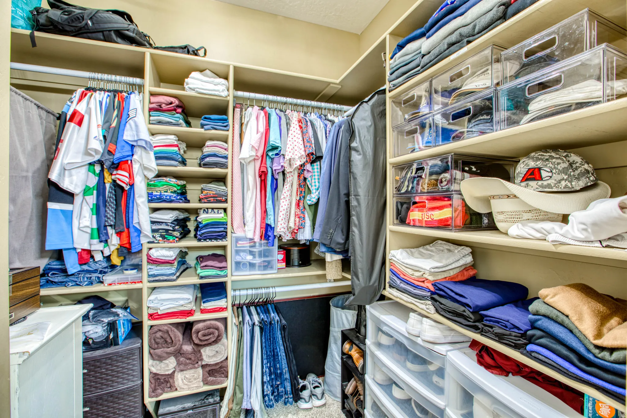 Built-in custom closet system with multiple shelving units and hanging rods