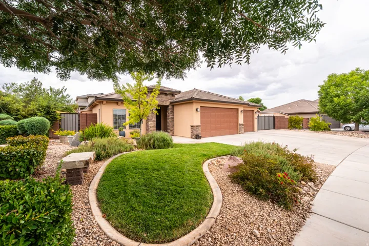 Stucco exterior with stone accents and two garage doors