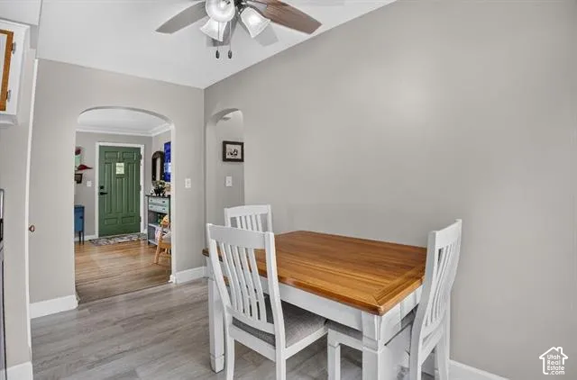 Light gray wall color with white trim and wood-finish flooring