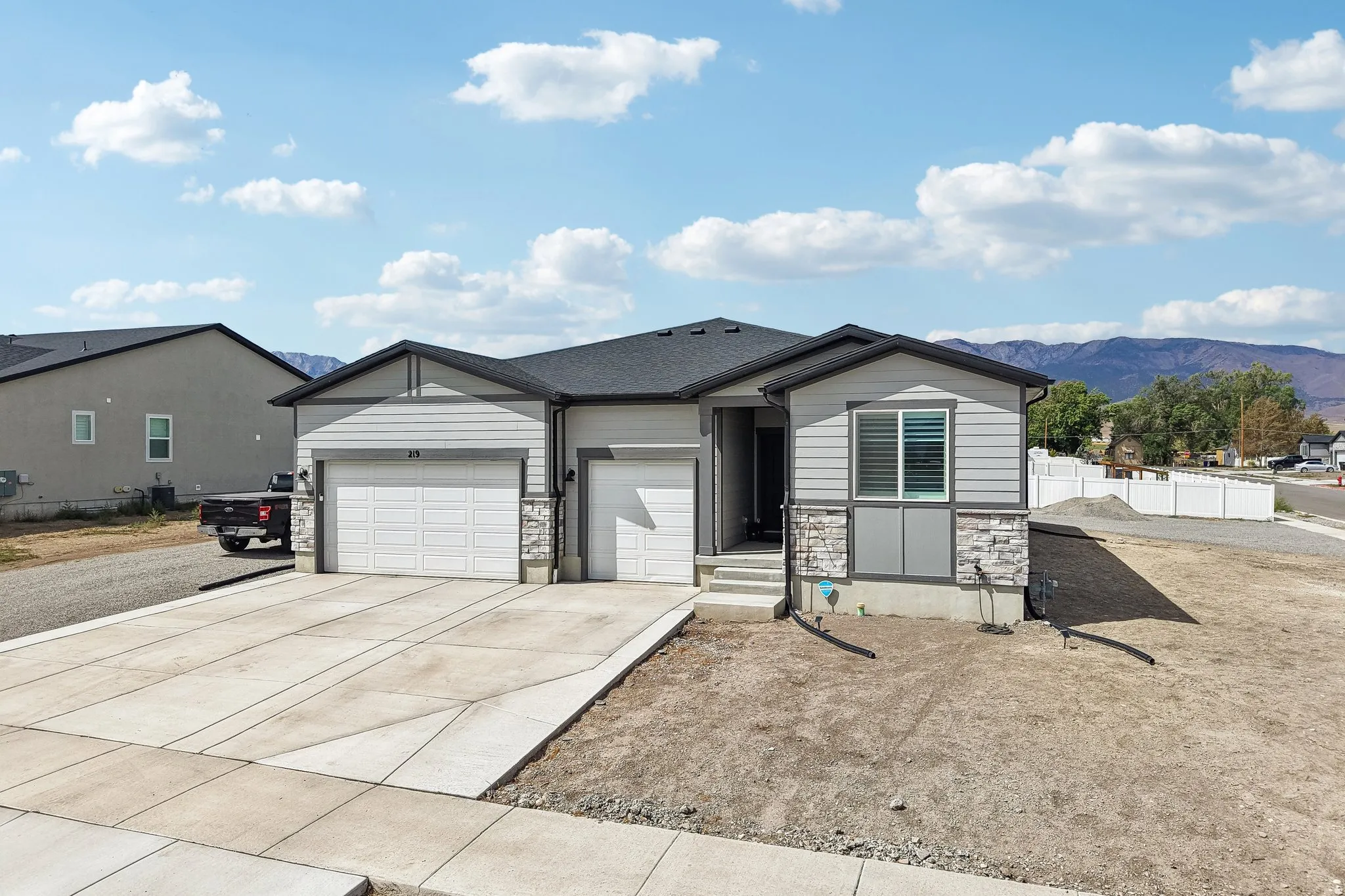 Contemporary exterior with horizontal siding and stone accents