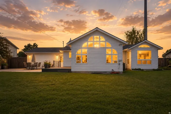 White siding exterior with multiple arched windows