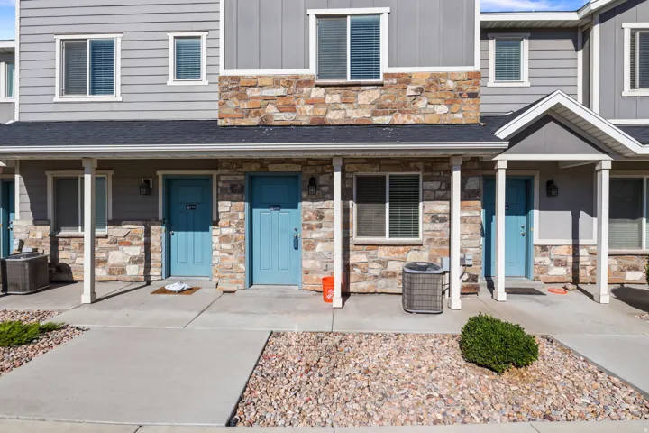Multi-level exterior featuring stone veneer and horizontal siding