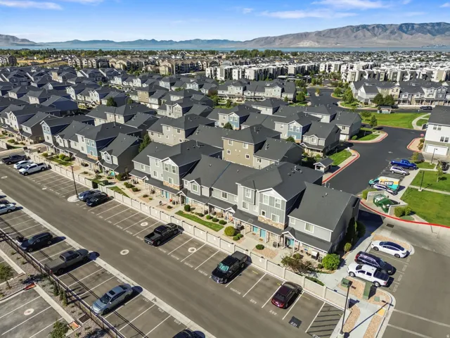 Townhome community featuring multi-story residences with varied exterior siding and dark pitched roofs